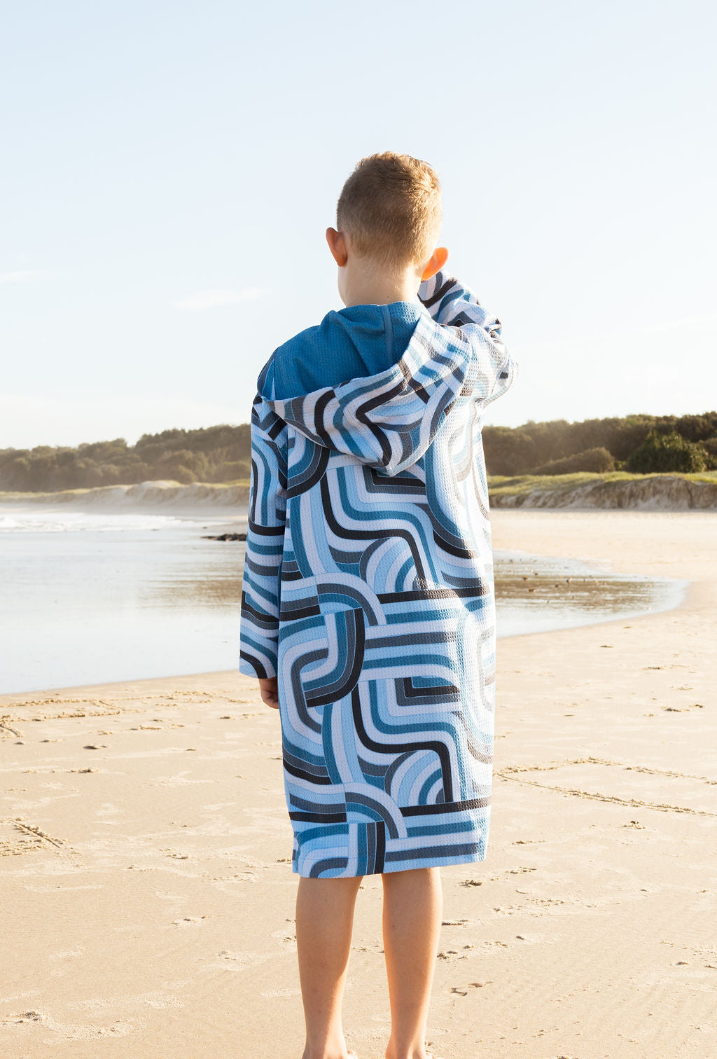 Child in Ocean Tide wearable towel – sand-free, full coverage