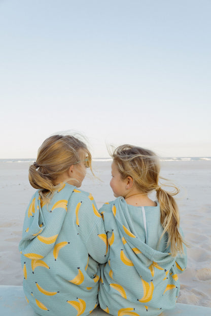 friends wearing banana party wearable towel